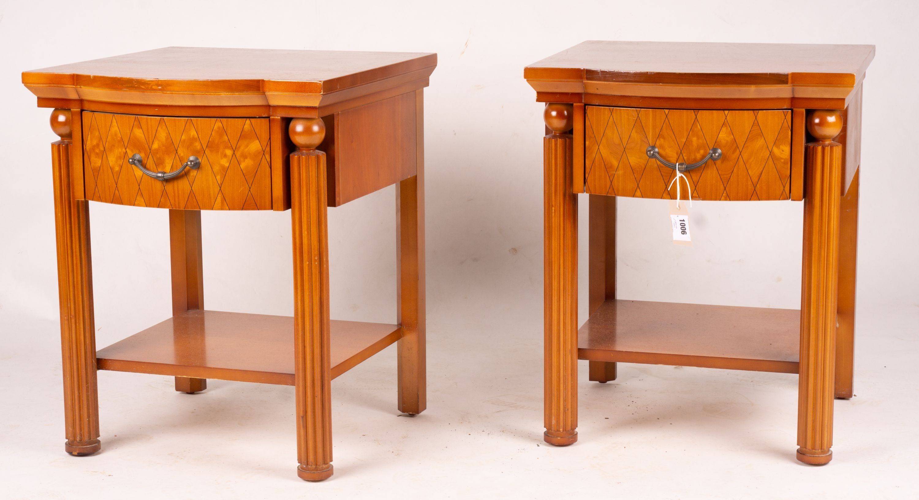 A pair of mahogany bowfront bedside cabinets, width 50cm, depth 50cm, height 62cm